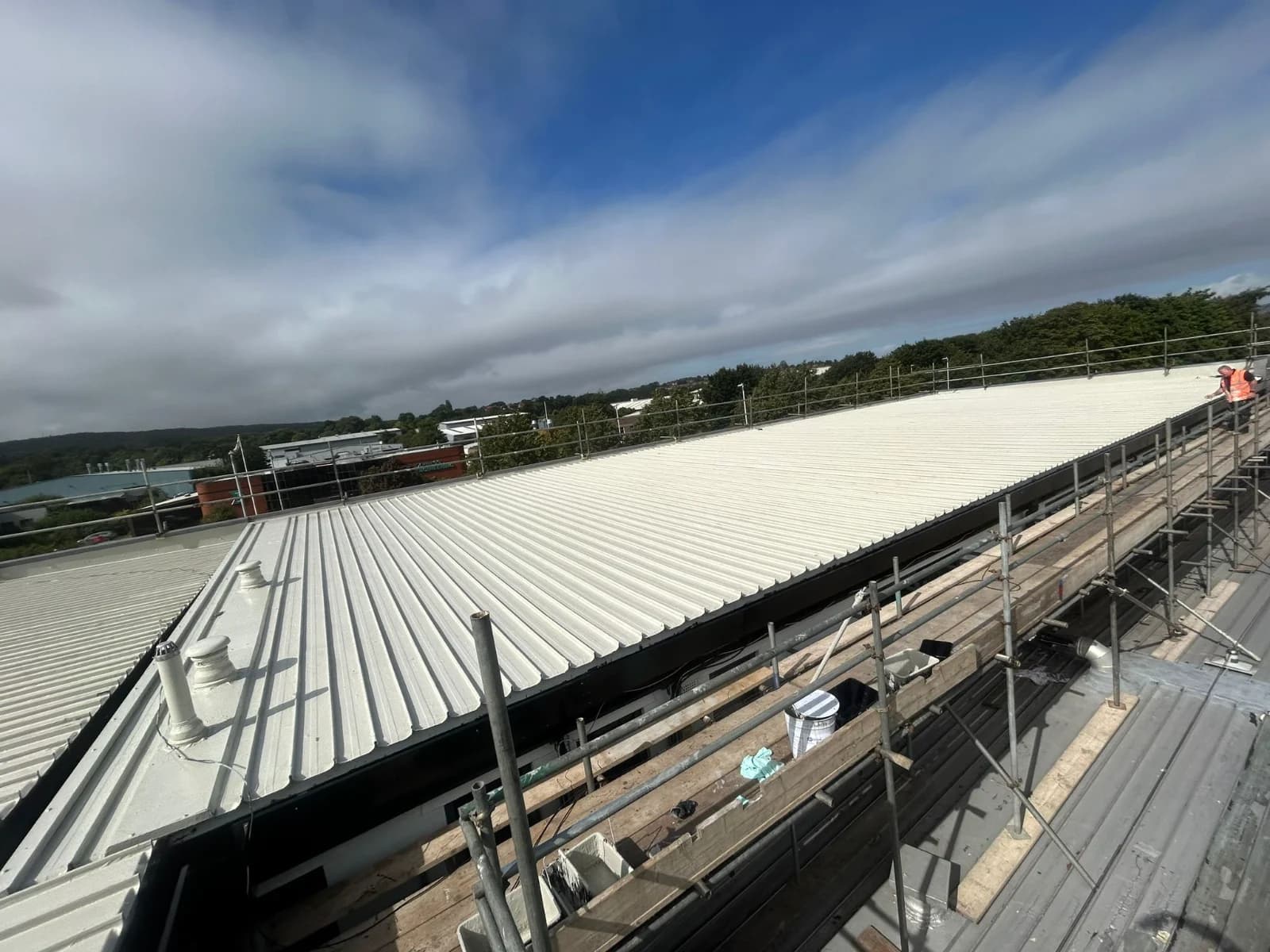Completed standing-seam metal roof on a commercial building in the Northeast
